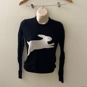 Long sleeved shirt Alice in wonderland themed.